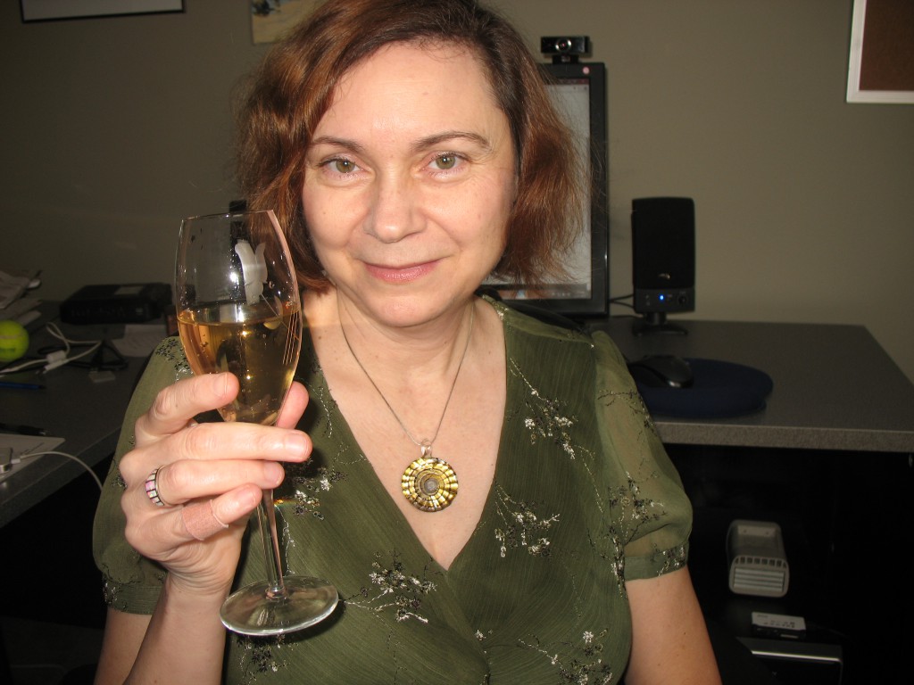 Adriane celebrating from her office in Vancouver area.